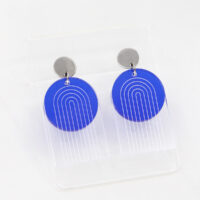 Pon Pon Through the Arch earrings in clear etched and frosted dark blue acrylic