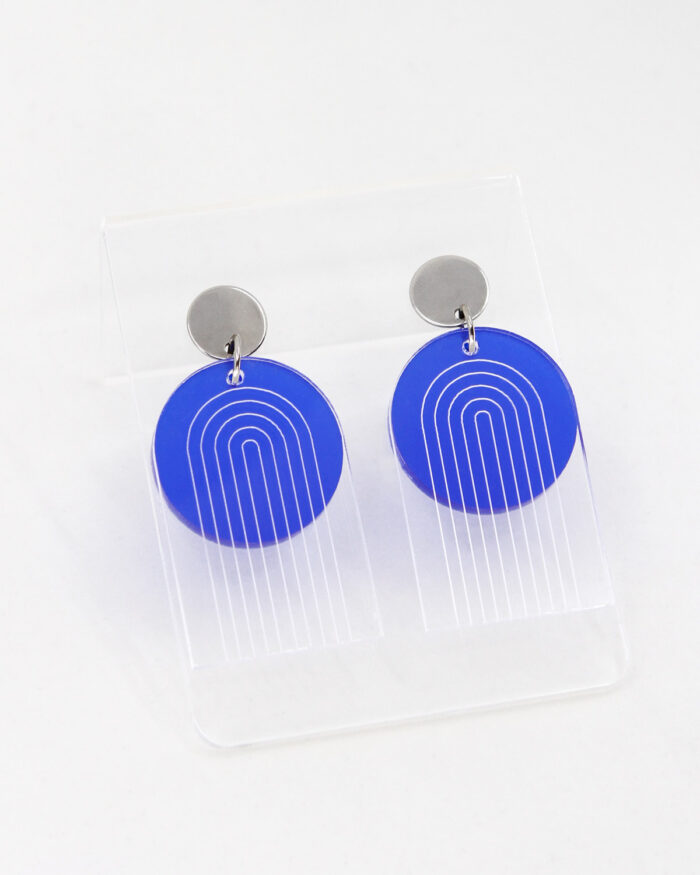 Pon Pon Through the Arch earrings in clear etched and frosted dark blue acrylic