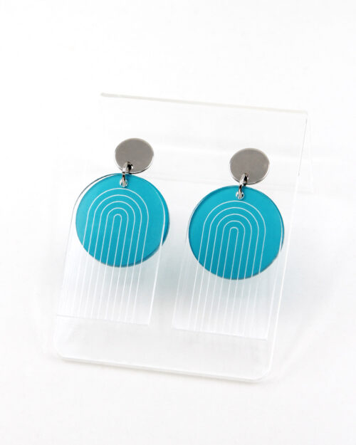 Pon Pon Through the Arch earrings in clear etched and frosted teal acrylic