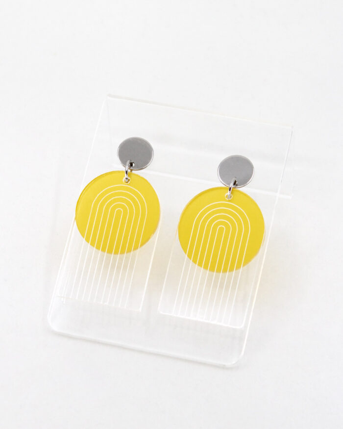 Pon Pon Through the Arch earrings in clear etched and frosted yellow acrylic