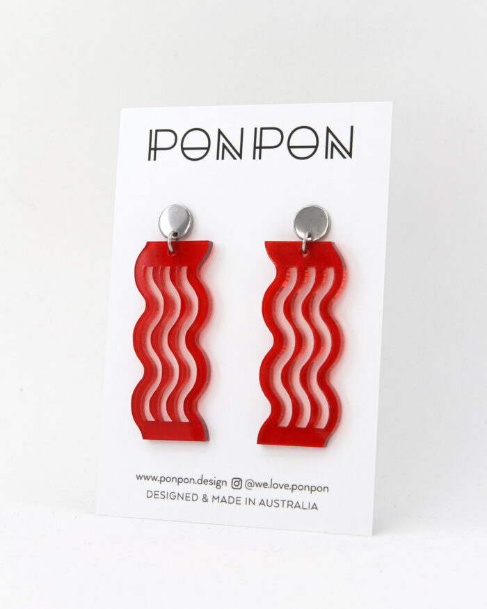 Pon Pon Acrylic Earrings in Transparent Red.