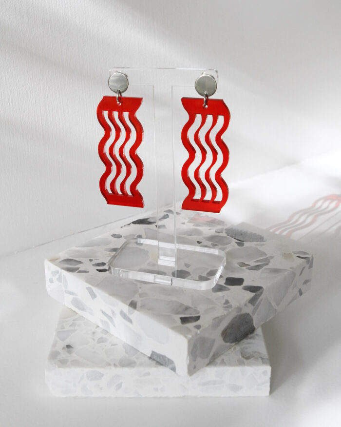 Pon Pon Acrylic Earrings in Transparent Red.