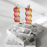 Pon Pon "Waves' acrylic earrings in warm gradient colour